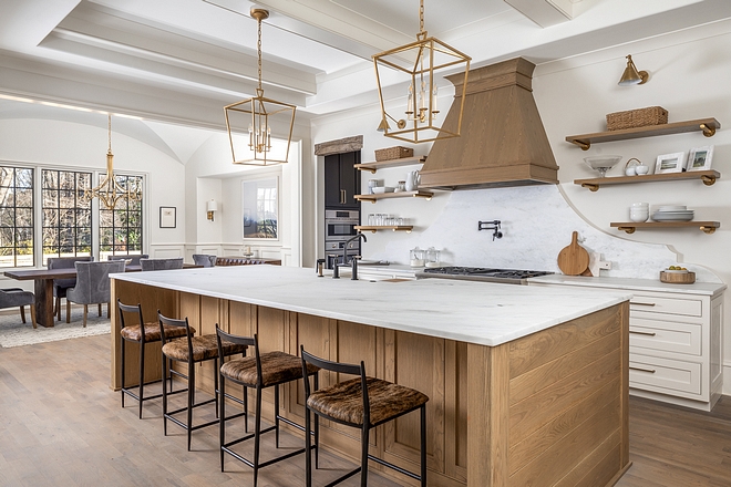 Open Kitchen We love this angle of the kitchen because it shows the open concept to the family dining room. A cased opening allows for each room to remain its own space, while still keeping the open concept buyers demand in this day in age, and allowing plentiful natural light to flow into the kitchen #kitchen #kitchenlayout #diningroom #kitcheninspo #kitchengoals #kitchendesign