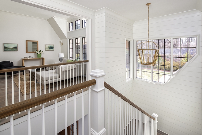 Shiplap A shiplap lovers heaven on earth A grand U-shaped staircase with floor to ceiling shiplap takes you from the first floor up to the second A unique pentagonal shaped window set brings in natural light #shiplap #shiplapstaircase #staircase #window