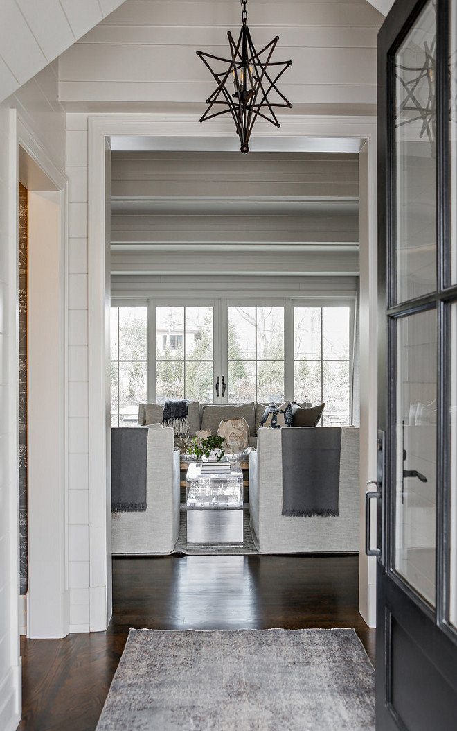 Modern Farmhouse Foyer Modern Farmhouse Foyer with shiplap clad walls and black front door #ModernFarmhouseFoyer #ModernFarmhouse #Foyer #shiplap #blackfrontdoor