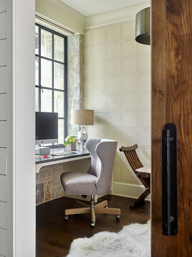 Home Office Small Home Office This small but elegant home office features a custom Oak barn door with rustic hardware, a Weathered Granite stone walls, black steel windows and a custom desk with side cabinets #office #homeoffice #smallhomeoffice #desk #wallpaper #customdesk