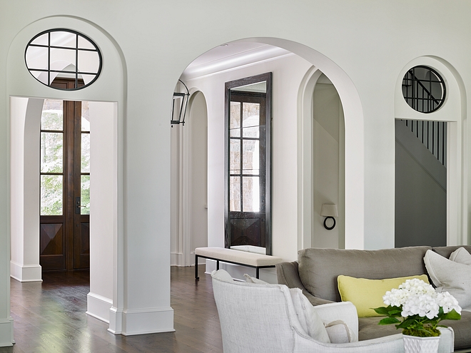 Custom black steel interior round windows add an impressive detail to the arched doorways of this home Custom black steel interior round windows add an impressive detail to the arched doorways of this home Custom black steel interior round windows add an impressive detail to the arched doorways of this home #blacksteelwindows #interiorwindows #roundbwindows #interiorblackwindows #archeddoorways