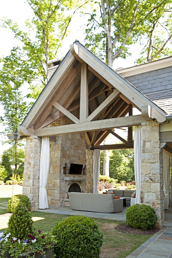 Stone Loggia This stunning loggia features impressive ceilings with limed Timber trusses and slate roof #loggia #stoneloggia #stonefireplace #timber #limedTimber #trusses #slateroof