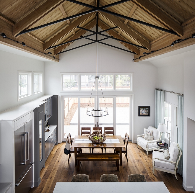 Sherwin Williams Ethereal White kitchen and dining area with Fir cathedral ceiling and Hickory hardwood flooring #SherwinWilliamsEtherealWhite #Firceiling #ceiling #cathedralceiling #Hickoryhardwoodflooring #hardwoodflooring #Hickory