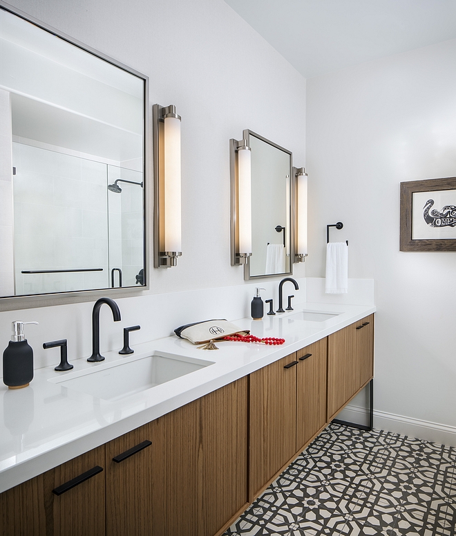 The master bathroom features a long Teak vanity with white quartz countertop and metal base #bathroom #teakvanity #Teak #Vanity