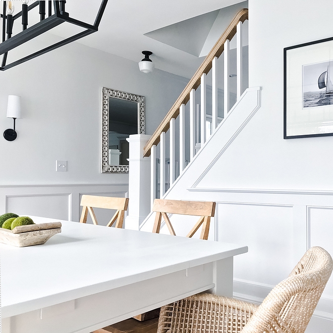 White interiors with black matte lighting and black and white photography Beautiful contrast against the white walls painted in Benjamin Moore Super White Black and white #BenjaminMooreSuperWhite #whiteinteriors #blackmatte #blackmattelighting #blackandwhite #blackandwhitephotography