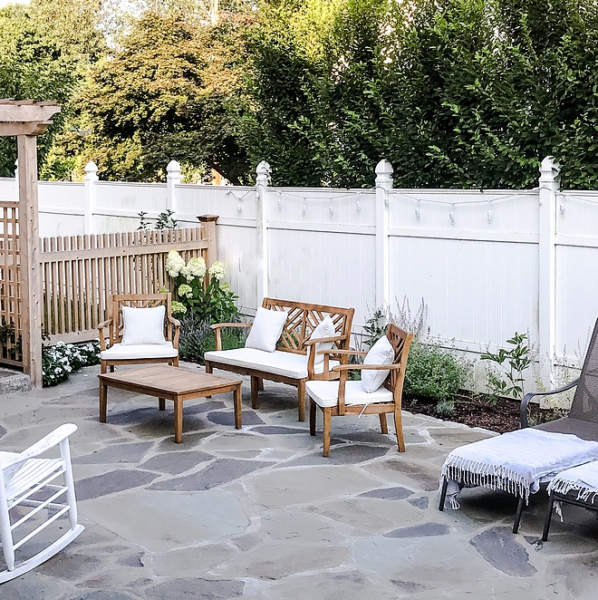 Bluestone patio Random size natural Bluestone patio Patio with Bluestone stone and white fence Bluestone stone patio ideas #Bluestonepatio #bluestone #patio #stonepatio