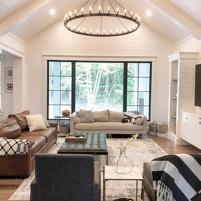 Shiplap Ceiling Our goal in our living room was to create a light and bright atmosphere that still felt warm and cozy Instead of doing an originally designed two story Great Room, we changed it to a vaulted 15.5 ft ceiling covered in shiplap We wanted the black chandelier to be a focal point, as well as the black window #shiplapceiling #shiplap #ceiling