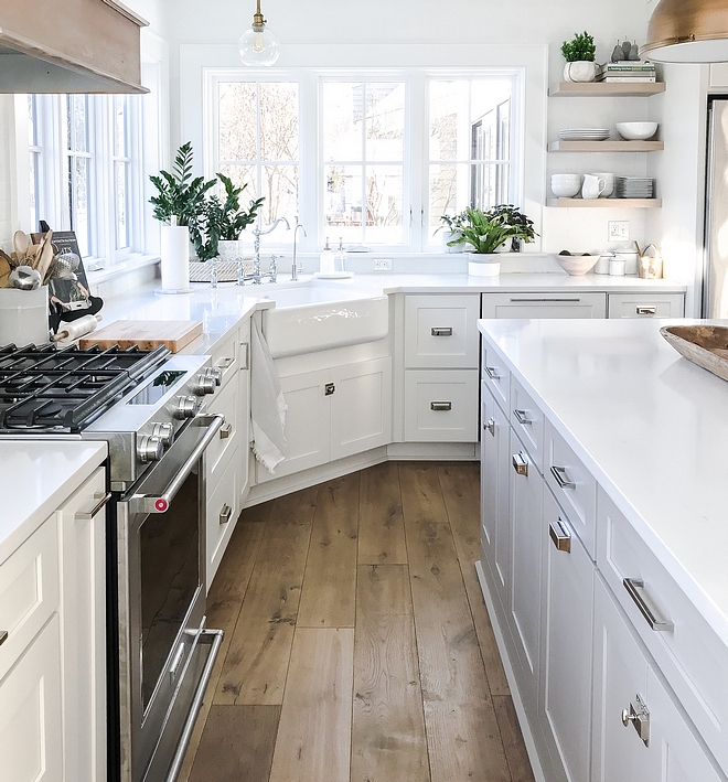 White kitchen with off white cabinets, white marble Quartz countertop, Martha Stewart cabinet hardware and wide plank hardwood flooring #whitekitchen #kitchen #classicwhitekitchen #classickitchen #kitchens #whitekitchens #kitchens #shakerkitchen