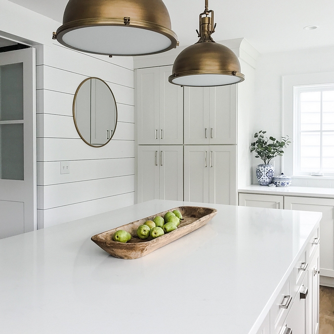 Silestone Statuario Quartz The kitchen countertop is Silestone Statuario Quartz It goes perfectly with the white perimeter cabinets and the grey island #SilestoneStatuarioQuartz #Quartz #countertop