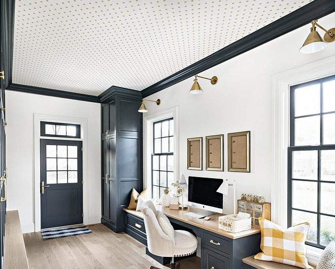 This gorgeous and practical mudroom features custom window-seats flanking a custom-built desk with White Oak countertop #mudroom #mudroomdesk #deak #windowseats #Whiteaok #mudroominspo #mudroomgoals #mudroomideas #mudroomdesign