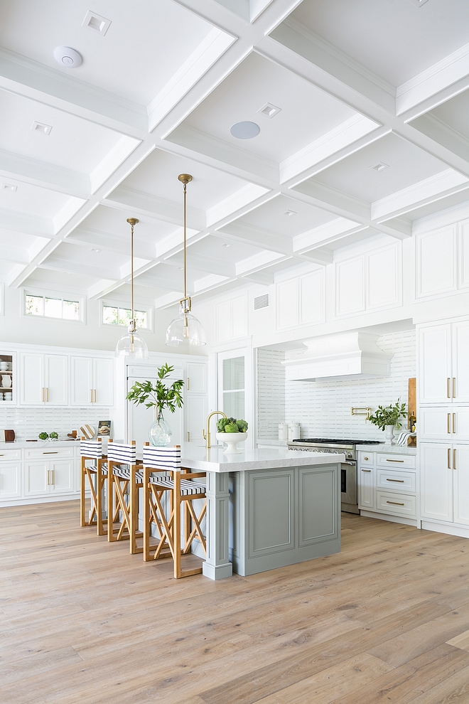 Coastal Farmhouse White Kitchen with light grey island and boxed beamed coffered ceiling Coastal Farmhouse White Kitchen Coastal Farmhouse White Kitchen #CoastalFarmhouse #CoastalFarmhousekitchen #WhiteKitchen #lightgreyisland