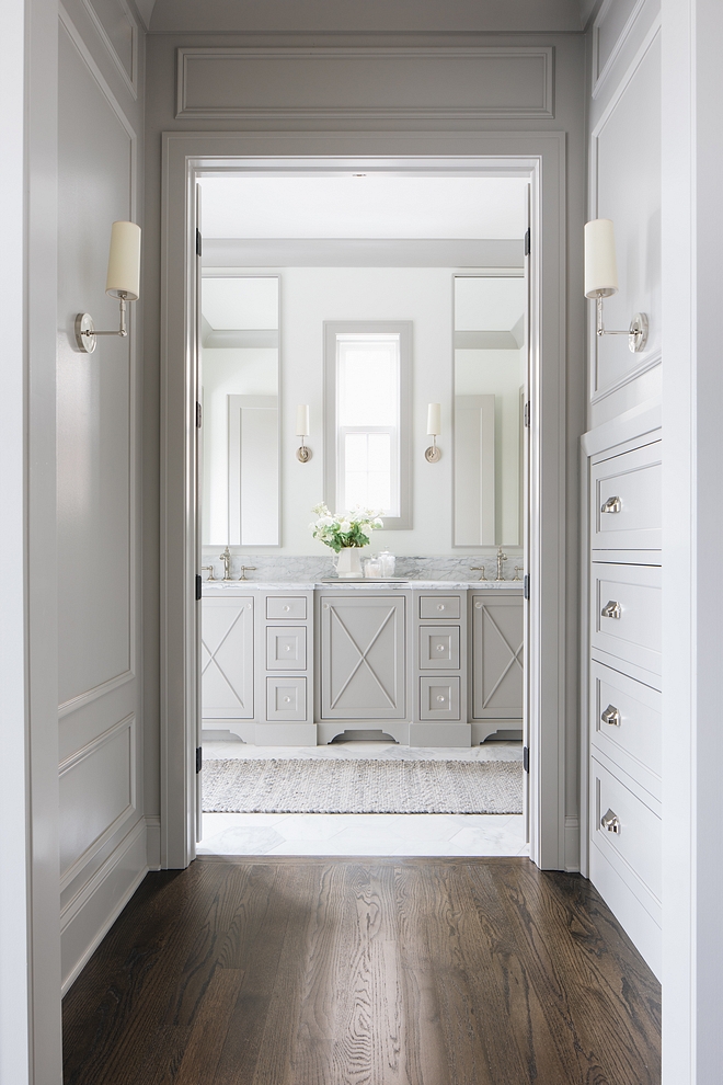 Master Bathroom Hallway with built-in dresser opens to a stunning grey master bahroom with x inset doors #bathroom #MasterBathroom #Hallway #builtidresser #greybatrhoom #bahroom #xinsetcabinetdoors