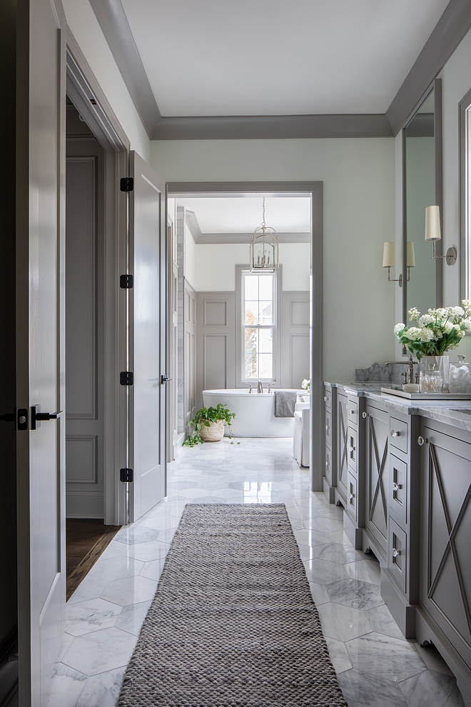 Bathroom design We didn’t want to clutter the tub area with cabinets so we separated the bathroom into two zones. The extra large vanity being zone one and the tub, shower, and water closet being zone two. These separate spaces give the bathroom it’s grand feel #bathroomdesign #bathroom