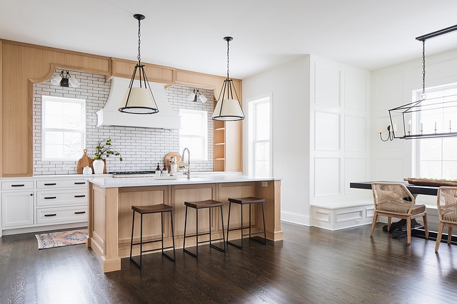 Breakfast room A breakfast room with built-in banquette and floor-to-ceiling custom paneling is located just off the kitchen area #breakfastroom#kitchen #banquette #paneling #breakfastrooms