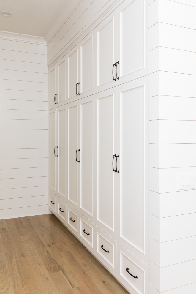 Mudroom cabinet This mudroom with shiplap is dreamy Walls are clad in shiplap and cabinets feature inset doors and drawers Flooring is 5" White Oak hardwood #mudroom #cabinet #mudroomcabinet #insetcabinet #mudroomdrawers #mudroomcabinetdoor #mudrooms #hardwoodflooring #shiplap