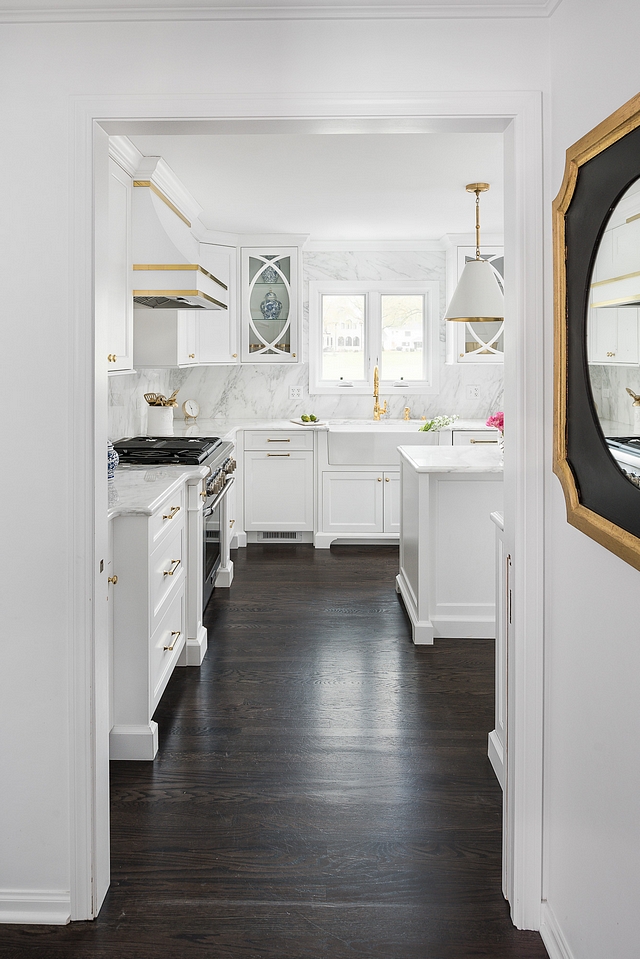 Walls and trim are painted in Benjamin Moore Super White Flooring is Oak hardwood floors with Ebony stain