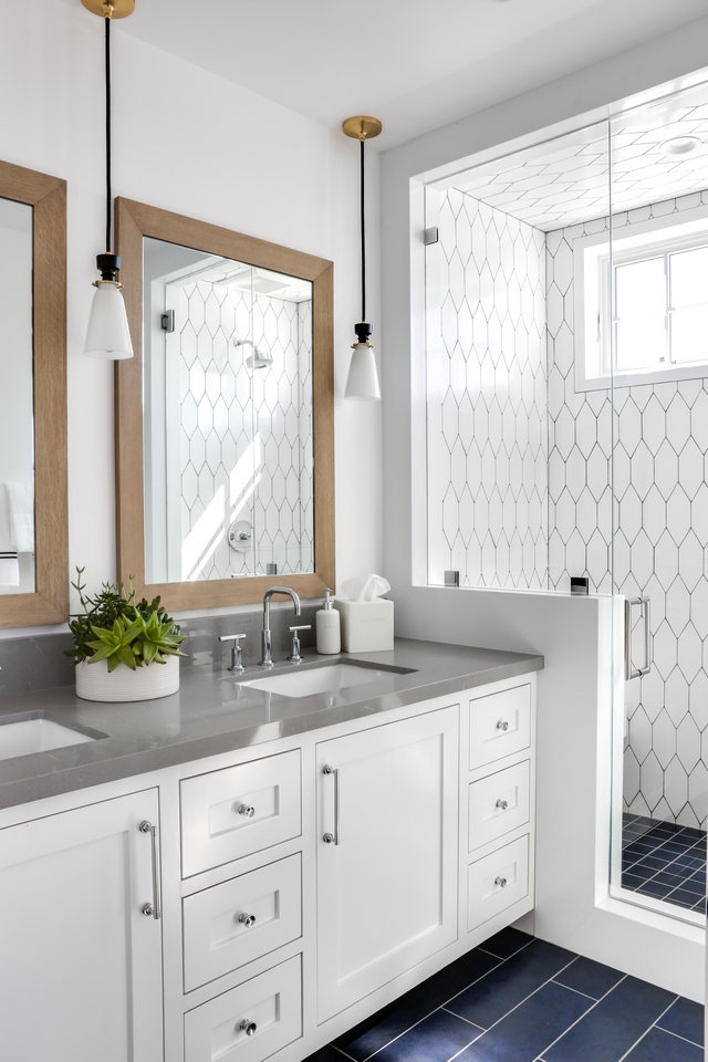 Bathroom with grey quartz countertop, white cabinets and unique flooring and wall tile #batthroom #Bathrooms #greyquartz #greycountertop #whitecabinets #uniqueflooring #uniquetile