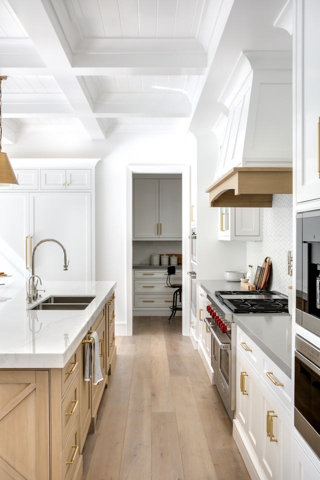 White Kitchen with White Oak hardwood flooring, White Oak kitchen island, White Oak kitchen hood trim and boxed coffered ceiling with tongue and groove #kitchen #WhiteKitchen #WhiteOakhardwoodflooring #hardwoodflooring #WhiteOakkitchenisland #WhiteOakkitchen #kitchenhood #hoodtrim #boxedbeamceiling #cofferedceiling #tongueandgroove