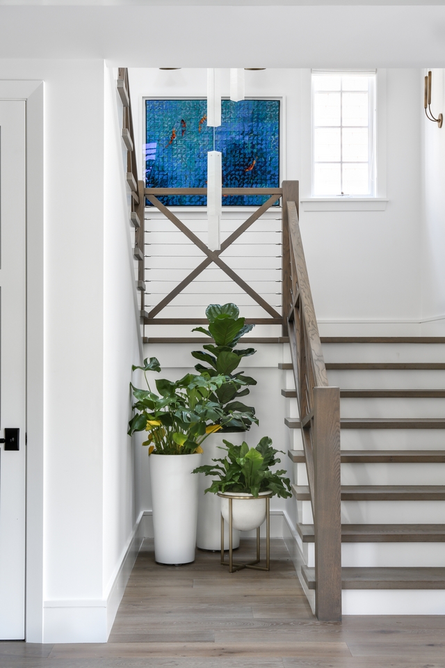 Farmhouse Staircase Railing The modern farmhouse-inspired staircase features wood and wire railing Farmhouse Staircase Railing Farmhouse Staircase Railing #FarmhouseStaircase #FarmhouseStaircaseRailing #woodandwirerailing