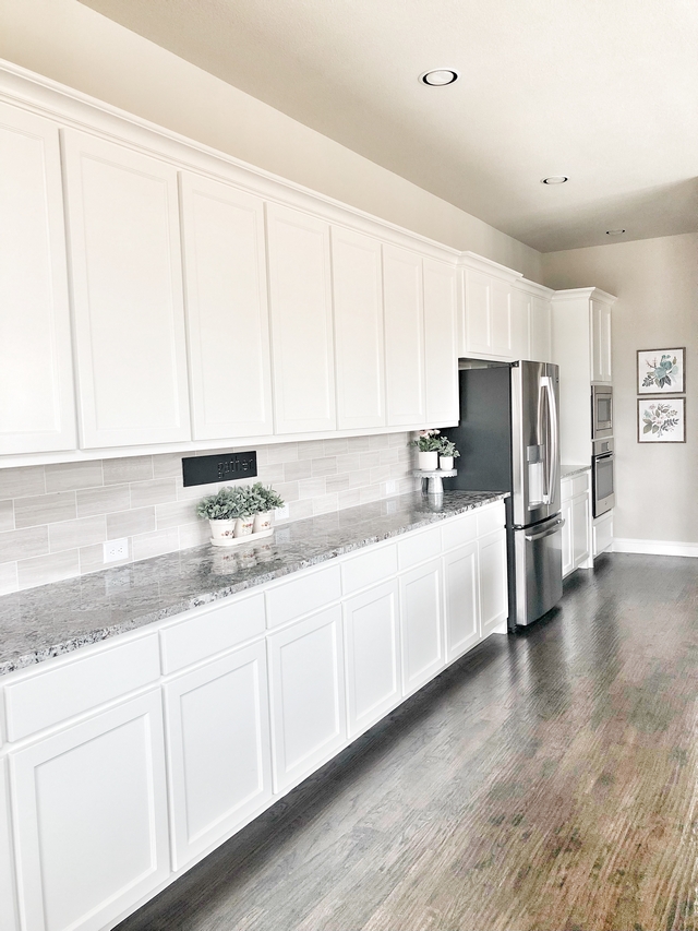 Long Kitchen Cabinet The best part of the kitchen is the long buffet countertop that’s perfect for entertaining because we like to host parties. This counter space runs almost 15 feet long so it holds all the food you could eat. #longkitchen #longcabinet #longkitchencabinet