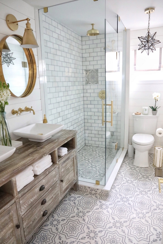 Bathroom Renovating Bathroom featuring grey and white cement floor tile, white marble subway tile on shower and a distressed Rough Sawn media cabinet transformed into vanity #bathroom #renovation #cementtile #bathroomrenovation #reno