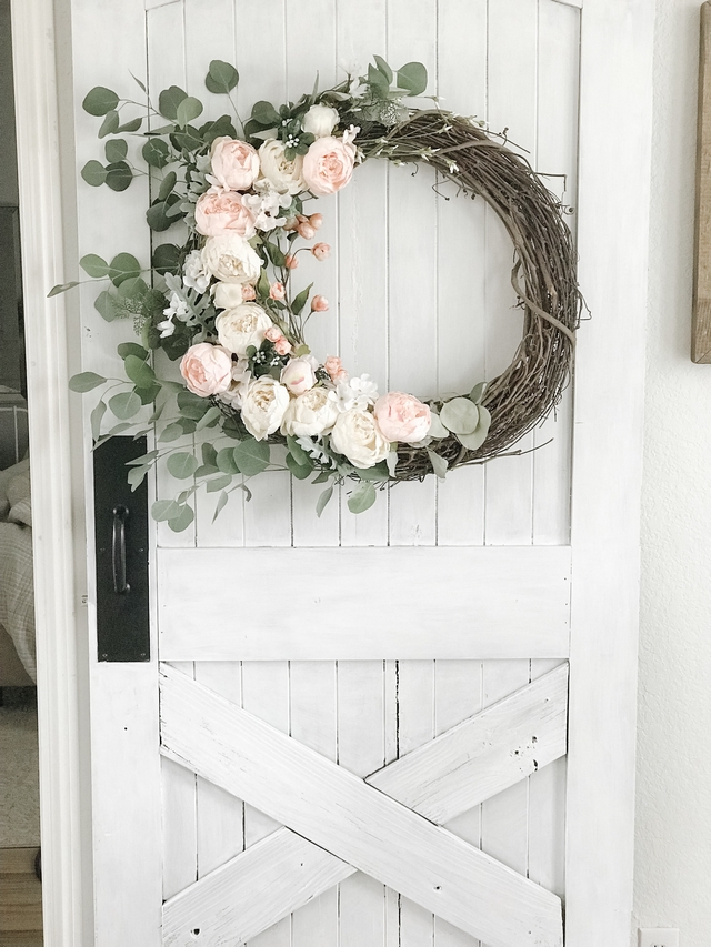 DIY Barn Door A beautiful wreath adds beauty to this diy barn door DIY Barn Door DIY Barn Door #DIYBarnDoor