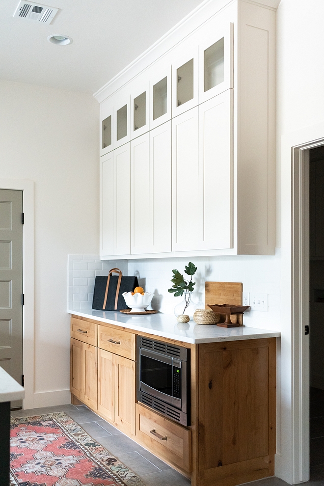 Kitchen Buffet Cabinet This two-toned kitchen buffet features custom-stained Maple lower cabinets and custom white upper cabinets with shaker doors #KitchenBuffetCabinet #Kitchen #BuffetCabinet #twotonedkitchen #shakerdoors