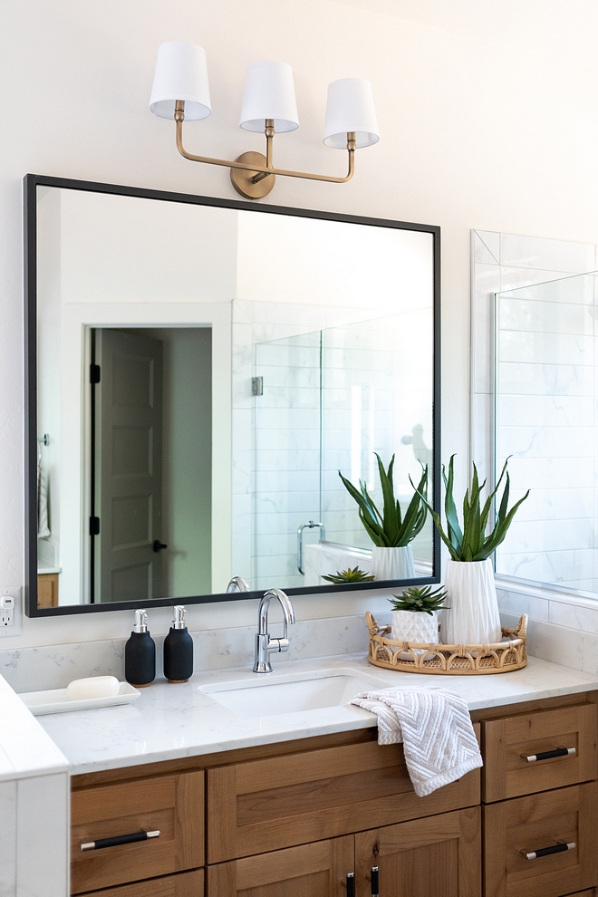 Bathroom countertop is marble-looking quartz. It looks really nice with the Maple cabinets #bathroom #countertop #quartz #woodcabinet