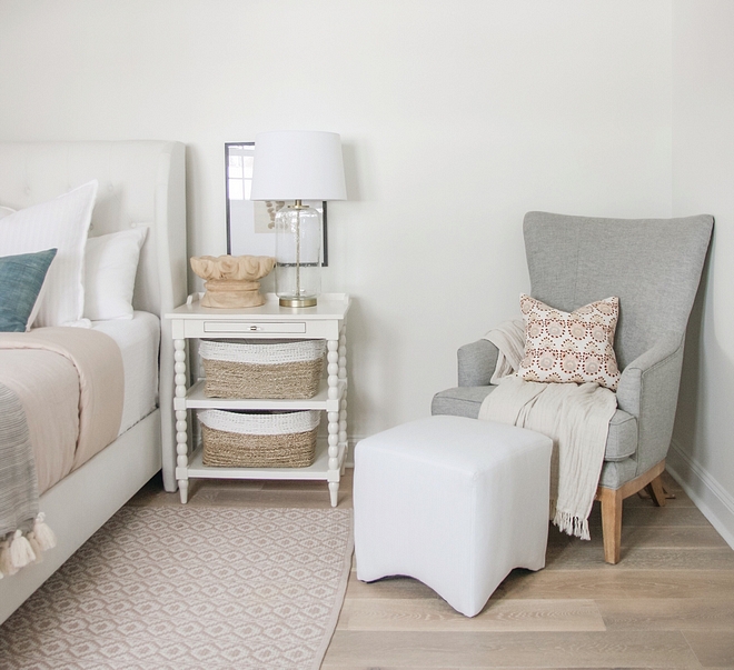 Grey mid century wingback chair An accent chair creates an inviting sitting area in the master bedroom #masterbedroom #sittingarea #accentchair #midcentury #midcenturywingbackchair #sittingarea