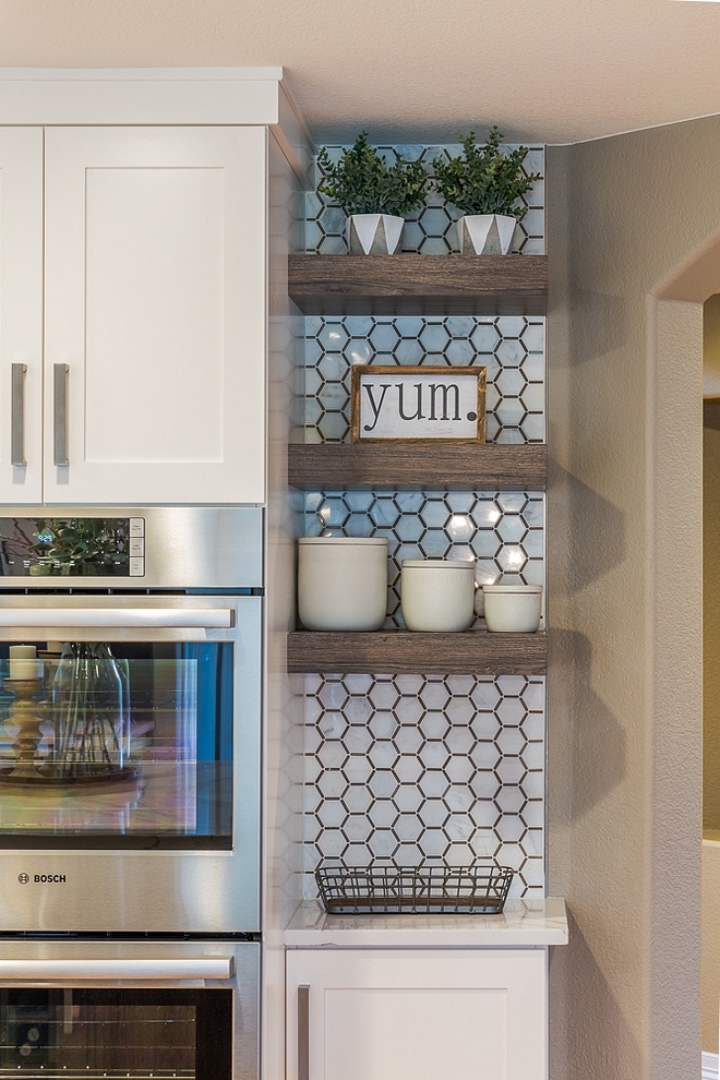 Kitchen floating shelves with accent tile Honeycomb Asian Statuary Marble with Athens Gray Line #Kitchen #floatingshelves #accenttile #Honeycombtile #AsianStatuary #Marble #tile