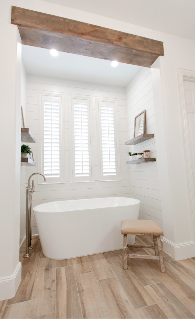 Bathroom beam Bathroom ceiling and shiplap This pictures gives an up close look of the beautiful spa tub and how the shiplap provides the right amount of texture and detail around it #Bathroom #beam #shiplap