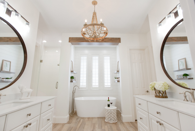 Master bathroom Renovation My goal was to transform my clients bathroom from a 1998 dark and dated bath into a Modern Farmhouse Spa Bath. After looking at the space and learning what my clients needs were, I started the design plan process. I wanted to use a clean and monochromatic look, so I chose to use a creamy white paint color throughout the space. Once that was decided, I layered in a mix of texture and design elements for visual interest. Those design elements included: the shiplap around the tub, the stained wood beam, stained wood floating shelves, the wood beaded chandelier #masterbathrenovation #reno