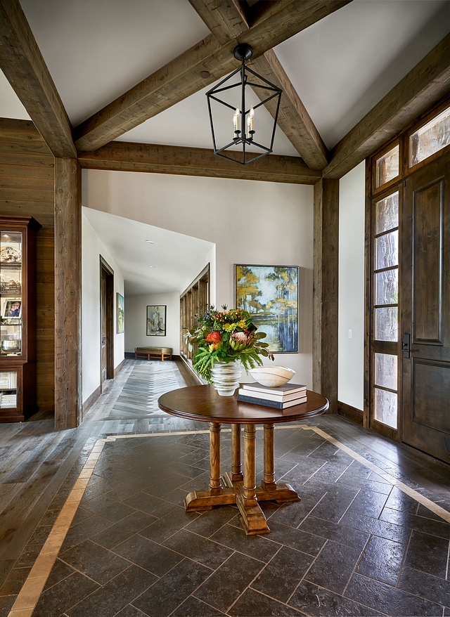 Entryway Foyer Beams The entry has beams that come together to provide some interest and also set the tone for the rustic feel of the home #entryway #foyer #Beams #rustic #rusticinteriors #rusticdesign
