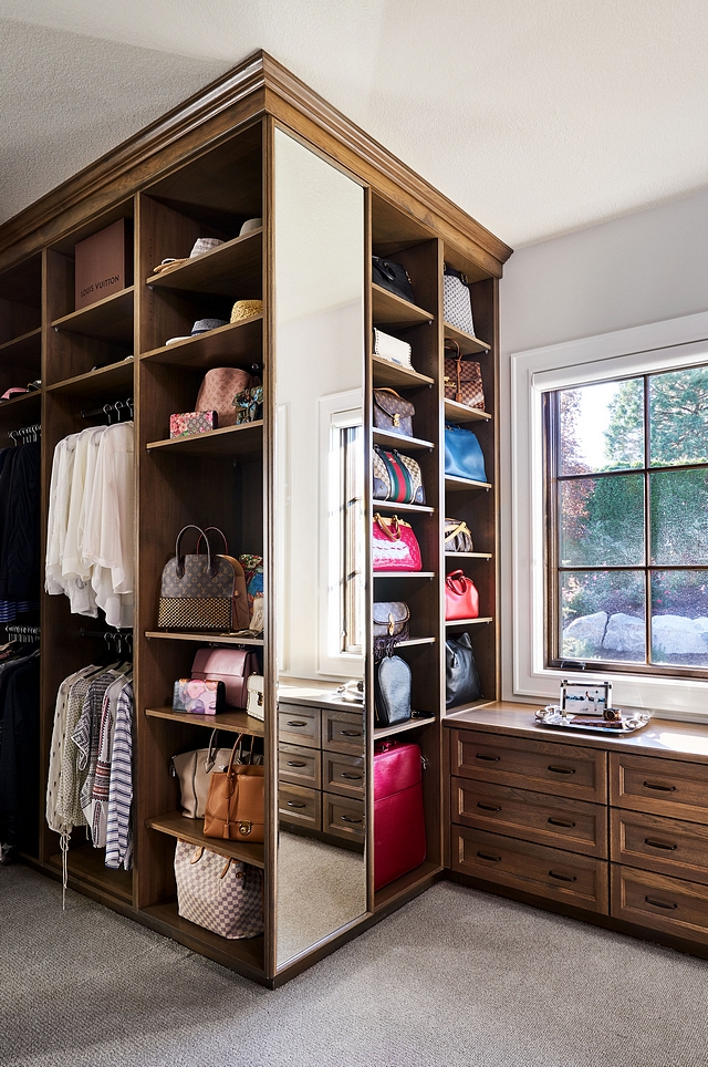 Closet cabinetry is Weathered Oak, recessed flat panel with decorative mold #closet #cabinetry