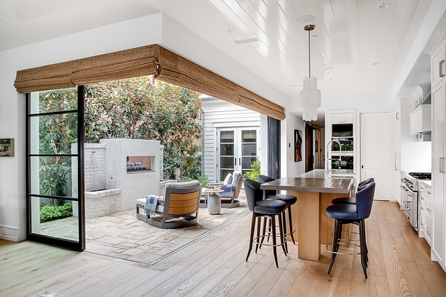 Large steel and glass bi-folding doors open seamlessly to the entry courtyard creating a great indoor outdoor entertainment space #patiodoor #bifoldingdoor #patiodoors #bifolddoor