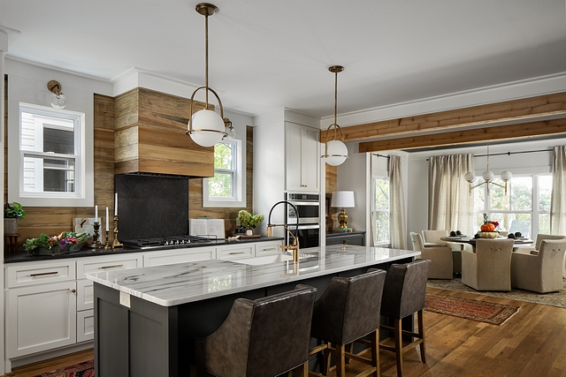 Transitional Rustic Kitchen The kitchen mixes reclaimed wood with white and black cabinetry Transitional Rustic Kitchen The kitchen mixes reclaimed wood with white and black cabinetry #Transitionalkitchen #RusticKitchen #kitchen #reclaimedwood #whitecabinet #blackcabinetry