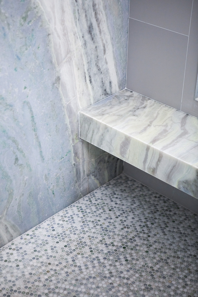 Shower tile Shower floor made of custom colored marble penny tile Walls and shower bench is Quartzite #shower #tile #showertile
