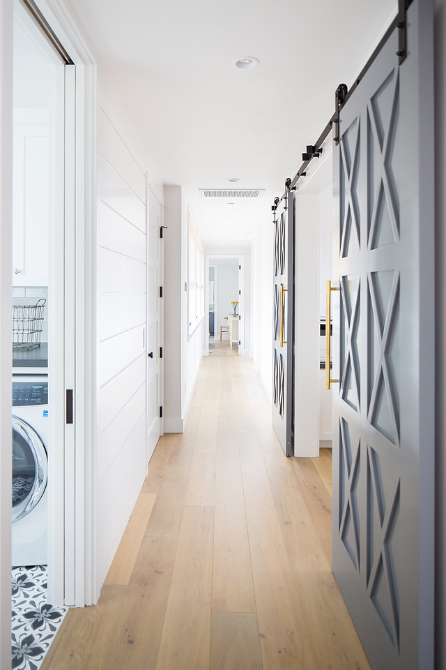 Hallway Main Hallway ideas The staircase leads to a long hallway with shiplap and wide plank hadwood floors Hallway Main Hallway Hallway Main Hallway Hallway Main Hallway #Hallway #MainHallway #shiplap #wideplank #hardwoodfloors #barndoors