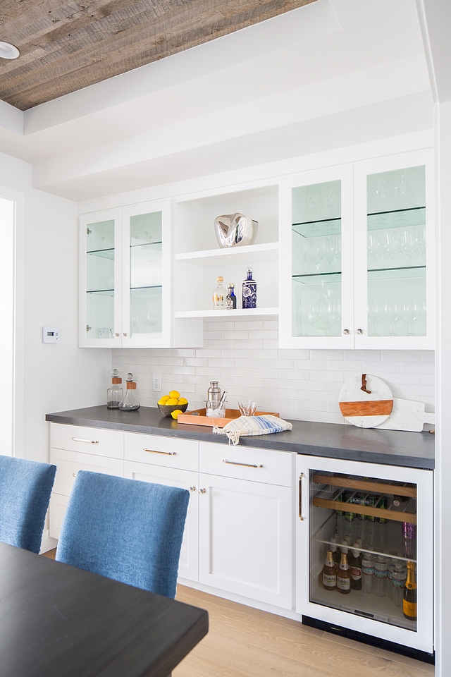 A butler's pantry is located on the other side of the dining room, just across from the table Dining Room Bar Cabinet Paint Color Dunn Edwards White DEW380 Dining Room Bar Cabinet #butlerpantry #DiningRoom #Bar #BarCabinet