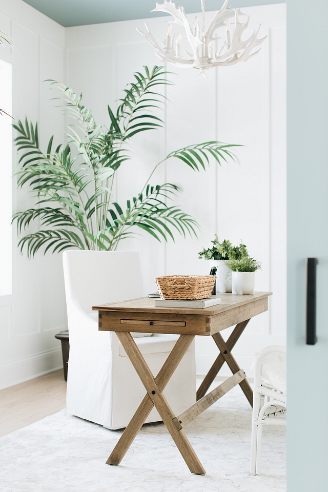 Home Office Costal farmhouse home office with board and batten paneling, blue ceiling and a neutral coastal farmhouse decor #HomeOffice #coastalfarmhouse #office #boardandbatten #paneling #blueceiling #neutraldecor #coastaldecor #farmhousedecor