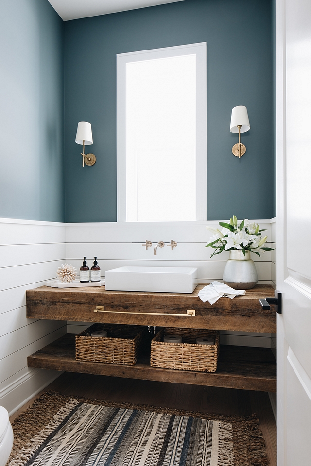 Farmhouse Bathroom features shiplap wainscoting and a custom floating vanity made out of reclaimed wood Bathroom features shiplap wainscoting and a custom floating vanity made out of reclaimed wood #bathroom #shiplap #wainscoting #shiplapwainscoting #floatingvanity #reclaimedwood #reclaimedwoodvanity #reclaimedwoodfloratingvanity