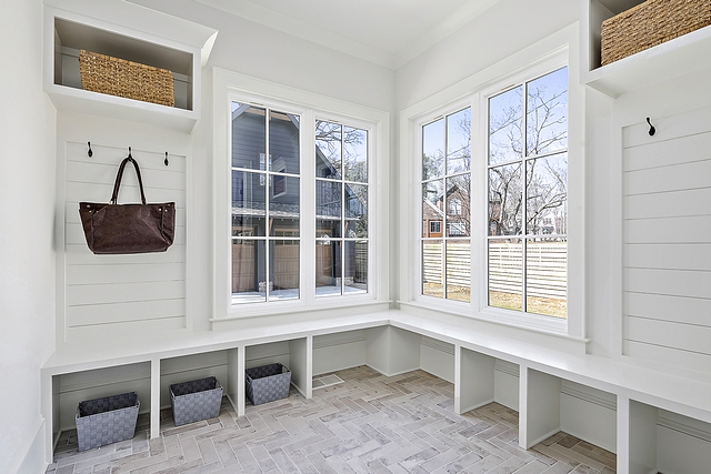 Mudroom shiplap and herringbone brick tile Durable brick tile ensures that you don't ruin your floors and allows for easy cleanup of messes #Mudroom #shiplap #herringbonebricktile