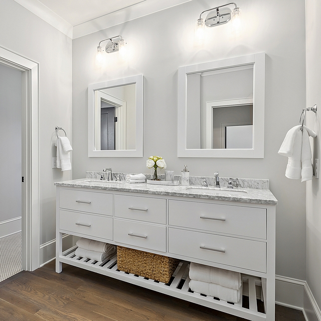 Paint color Benjamin Moore Moonshine bathroom Carrying the hardwoods into the bathroom is a great look, especially given the white furniture vanity #bathroom #Paintcolor #BenjaminMooreMoonshine