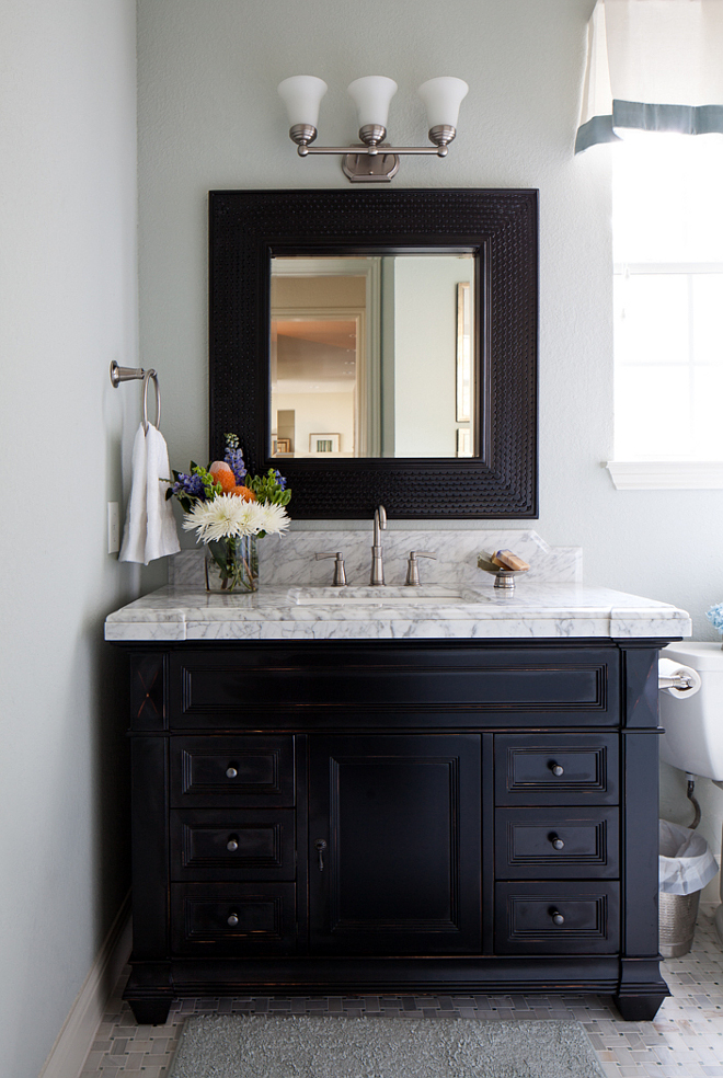 Black vanity, painted in Benjamin Moore Onyx, with a distressed finish Black vanity, painted in Benjamin Moore Onyx, with a distressed finish Benjamin Moore Onyx #BenjaminMooreOnyx #blackvanity #distressedvanity