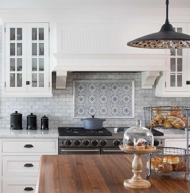 Range Accent Tile Over the range, we added hand painted Carrara tiles with picture moldings Kitchen Range Accent Tile Ideas Range Accent Tile #Range #AccentTile