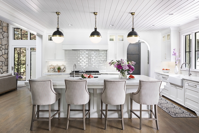 Kitchen The island features white honed Carrera marble countertop under the dramatic black and gold globe pendants We added a glossy, subway tile on the backsplash #kitchen #Kitchenisland #whitemarblecountertop #honedCarreracountertopmarble #countertop #blackandgoldglobependants #globependants #subwaytile #backsplash