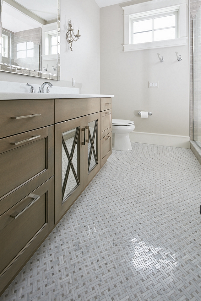 White Oak Cabinet This guest bathroom features a custom vanity with X inset mirrored doors in a Pewter Glaze White Oak Cabinet This guest bathroom features a custom vanity with X inset mirrored doors in a Pewter Glaze White Oak Cabinet This guest bathroom features a custom vanity with X inset mirrored doors in a Pewter Glaze White Oak Cabinet This guest bathroom features a custom vanity with X inset mirrored doors in a Pewter Glaze #WhiteOakCabinet #bathroom #vanity #Xinsetcabinet #mirroredcabinetdoor