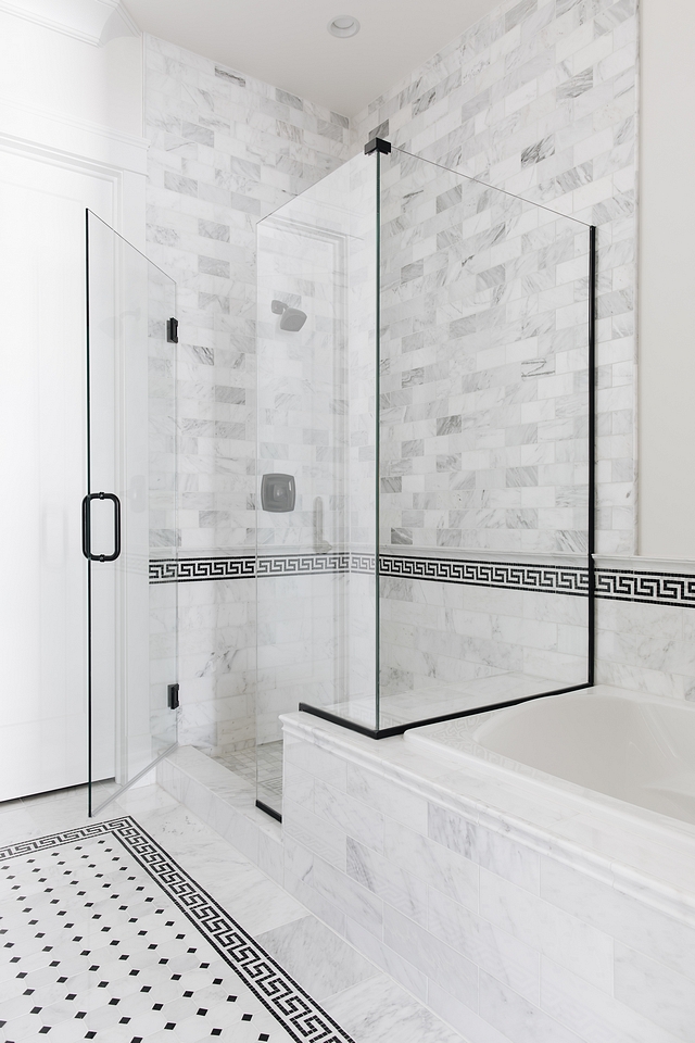 Greek key border tile Bathroom Greek key border tile The glass shower features marble subway wall and floor tiles and it's accented with black and white Greek key border tiles #Bathroom #Bathroomtile #Greekkeytile #bordertile