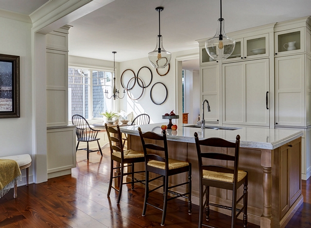 Farmhouse Kitchen Glass pendants over the island, rustic wall art, and wide plank pine flooring completes the farmhouse look of this kitchen #FarmhouseKitchen #Kitchen #Whitefarmhousekitchen