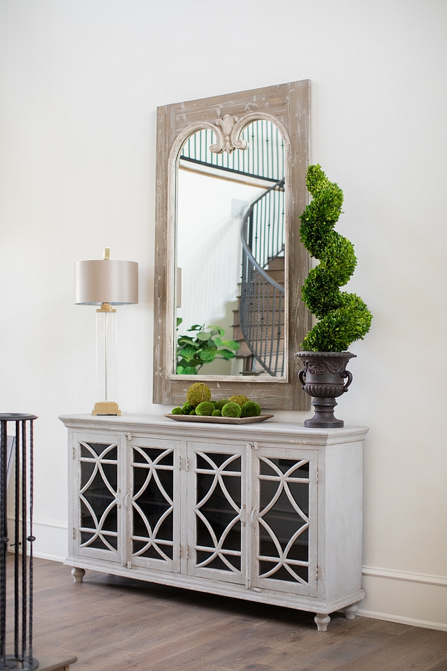 French foyer decor design ideas French home foyer featuring graywash cabinet and reclaimed wood French Mirror and topiary French foyer decor design ideas French home foyer #Frenchfoyer #foyerdecor #foyer #foyerdesign #Frenchhome #entryway #mirror #cabinet #topiary #decor